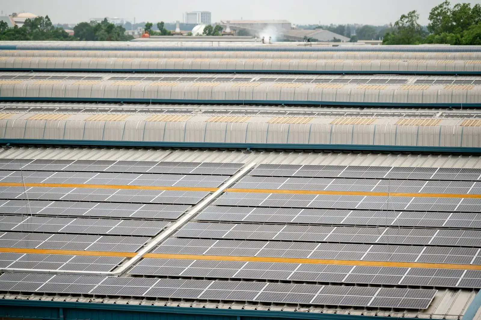 Large industrial factory roof fitted with solar panels