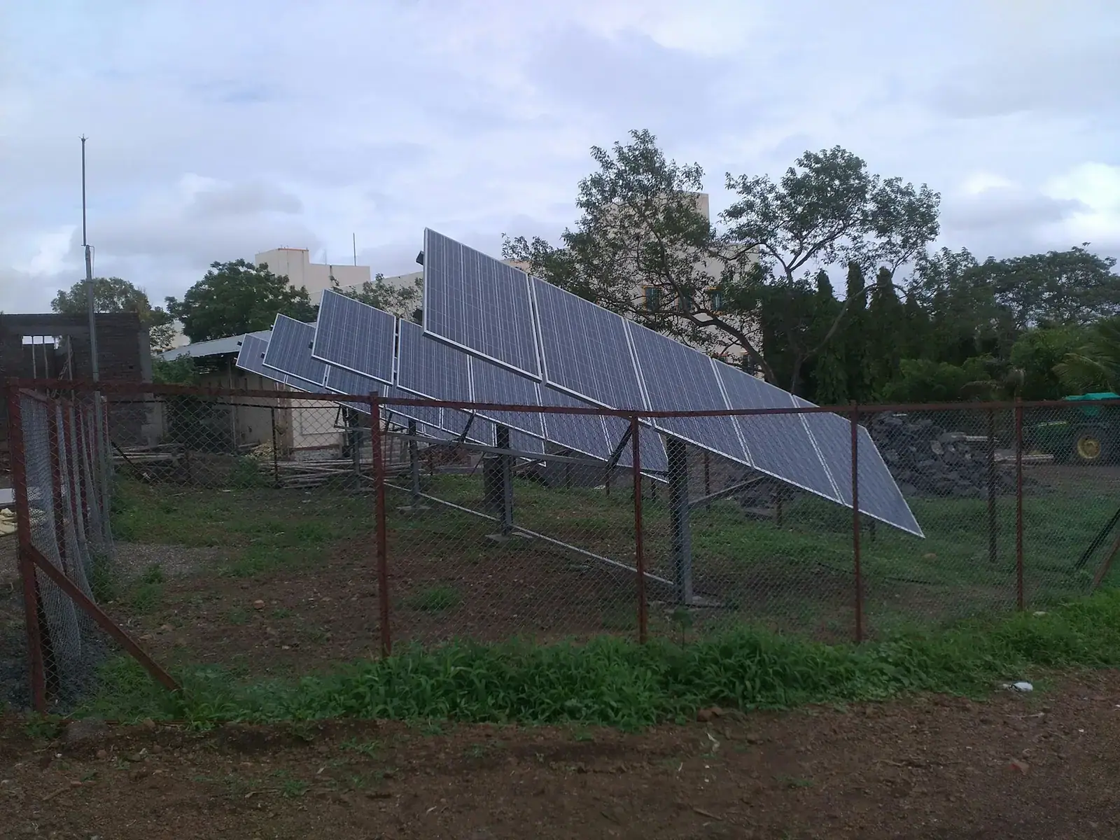 Elevated solar panel array on farmland for agricultural use